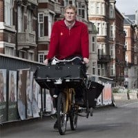 Postbud på cykel Postbud på cykel